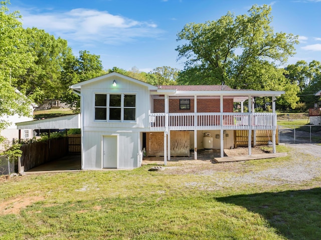 9027 Wooten Rd, Chattanooga, TN 37416 - rear view of property with a lawn, fence, and a deck