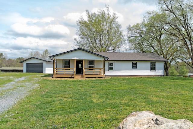 view of front of home with a detached garage, a porch, an outdoor structure, and a front lawn