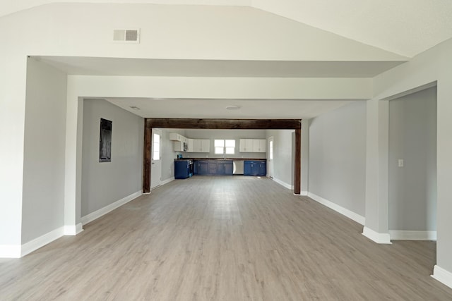 unfurnished living room with light wood finished floors, baseboards, and visible vents