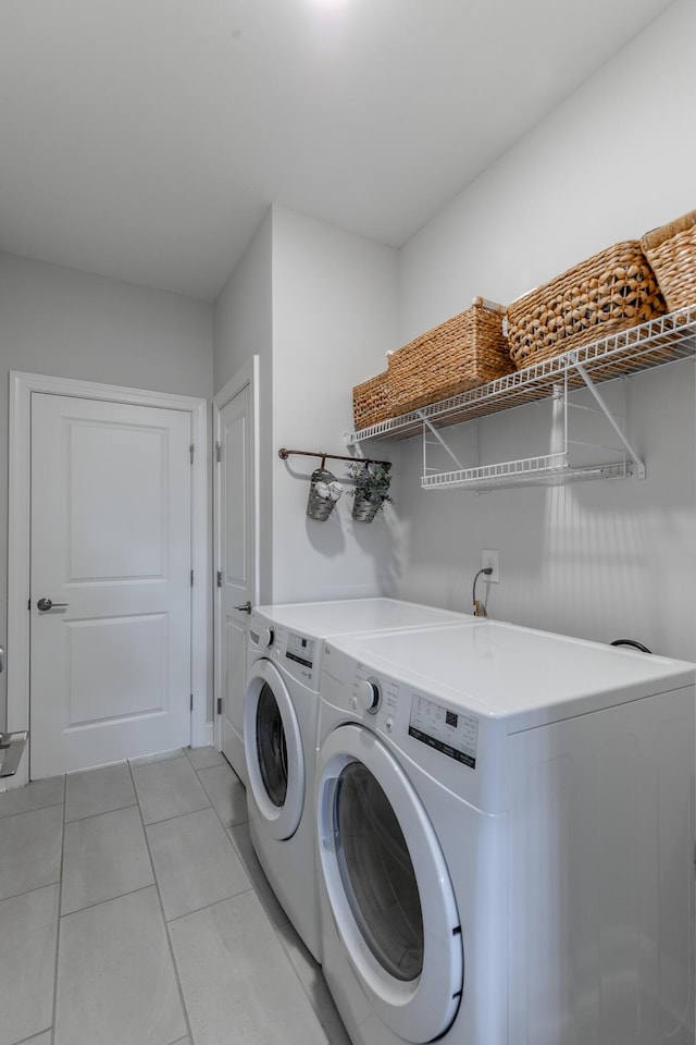 971 Jackson Mill Dr, Hixson, TN 37343 - laundry area featuring light tile patterned floors, independent washer and dryer, and laundry area