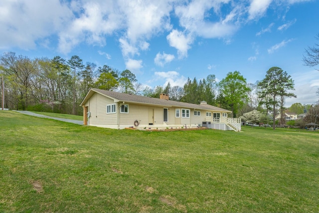 2041 Linwood Cir, Soddy Daisy, TN 37379 - back of house featuring a chimney and a yard