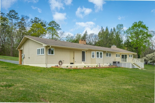 2041 Linwood Cir, Soddy Daisy, TN 37379 - back of house with central AC, a chimney, and a lawn