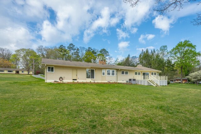 2041 Linwood Cir, Soddy Daisy, TN 37379 - rear view of property with a yard and a chimney