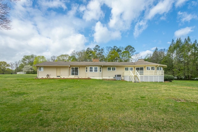 2041 Linwood Cir, Soddy Daisy, TN 37379 - rear view of house with a chimney and a lawn