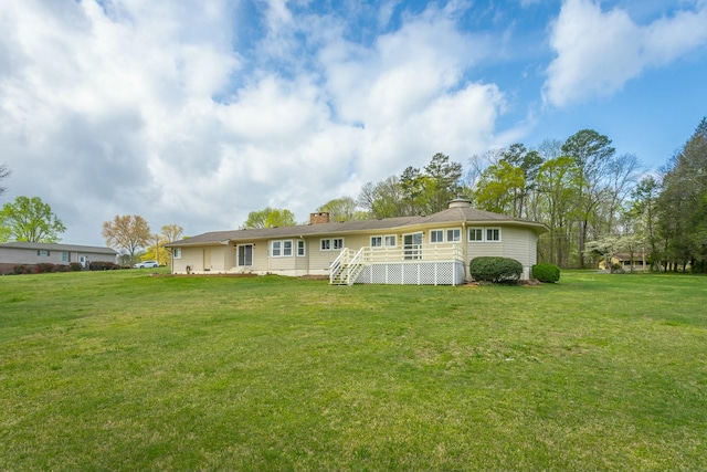 2041 Linwood Cir, Soddy Daisy, TN 37379 - rear view of house featuring a chimney, a yard, and stairs