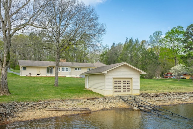 2041 Linwood Cir, Soddy Daisy, TN 37379 - back of house with a yard, a garage, an outdoor structure, and a water view