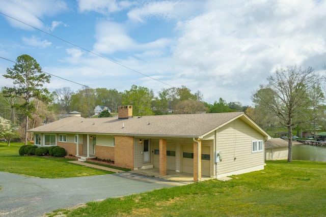 2041 Linwood Cir, Soddy Daisy, TN 37379 - single story home with a front yard, a shingled roof, a chimney, brick siding, and driveway
