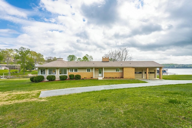 2041 Linwood Cir, Soddy Daisy, TN 37379 - single story home with a front yard, brick siding, an attached garage, a chimney, and concrete driveway
