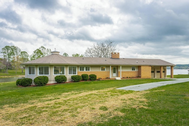 2041 Linwood Cir, Soddy Daisy, TN 37379 - rear view of house with a chimney and a lawn