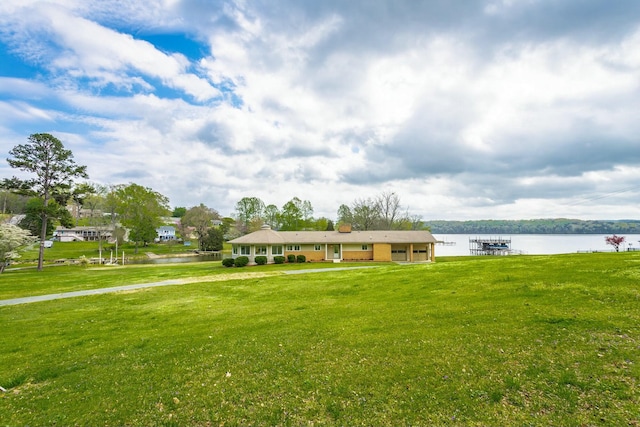 2041 Linwood Cir, Soddy Daisy, TN 37379 - view of front of property featuring a water view, a boat dock, and a front lawn