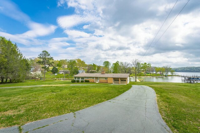 2041 Linwood Cir, Soddy Daisy, TN 37379 - ranch-style home with a chimney, a front lawn, and a water view