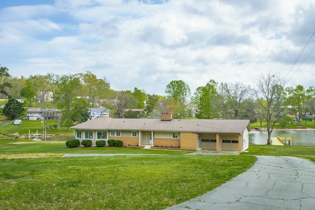 2041 Linwood Cir, Soddy Daisy, TN 37379 - single story home featuring aphalt driveway, a garage, a front lawn, and a chimney