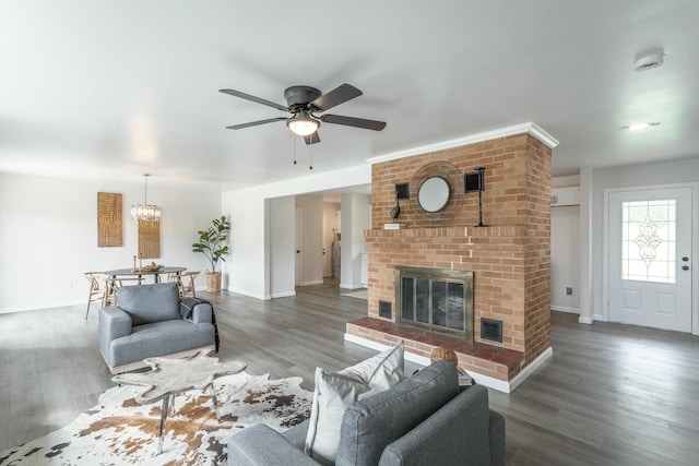2041 Linwood Cir, Soddy Daisy, TN 37379 - living area featuring visible vents, baseboards, a fireplace, wood finished floors, and ceiling fan with notable chandelier