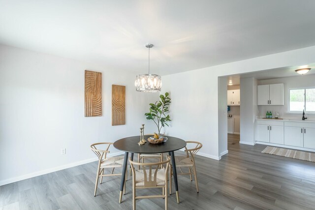 2041 Linwood Cir, Soddy Daisy, TN 37379 - dining room with a chandelier, baseboards, and wood finished floors