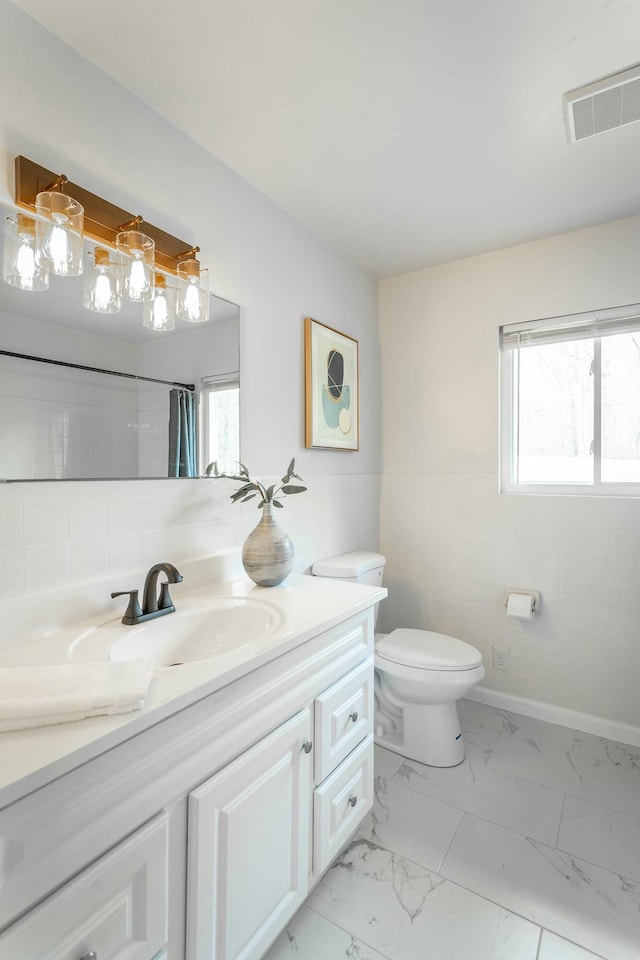 2041 Linwood Cir, Soddy Daisy, TN 37379 - full bathroom with vanity, visible vents, marble finish floor, and a healthy amount of sunlight