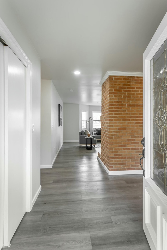 2041 Linwood Cir, Soddy Daisy, TN 37379 - hall featuring baseboards, wood finished floors, and brick wall