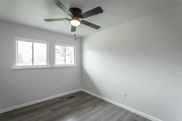 2041 Linwood Cir, Soddy Daisy, TN 37379 - spare room with visible vents, baseboards, ceiling fan, and wood finished floors