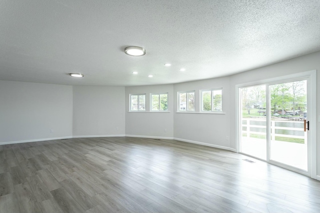 2041 Linwood Cir, Soddy Daisy, TN 37379 - unfurnished room featuring visible vents, baseboards, and wood finished floors