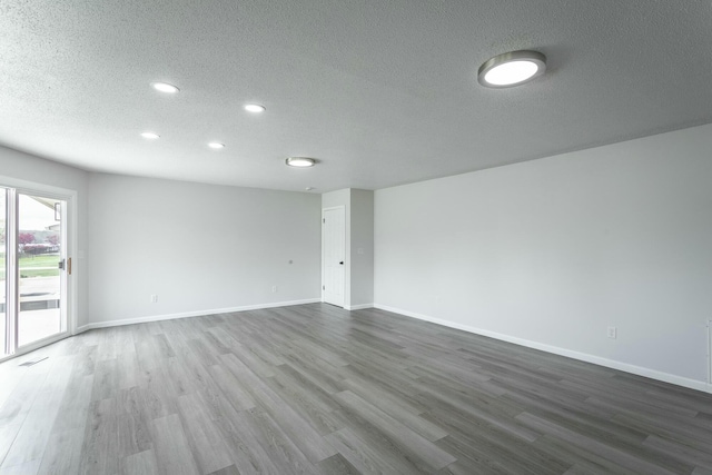 2041 Linwood Cir, Soddy Daisy, TN 37379 - empty room with recessed lighting, baseboards, a textured ceiling, and dark wood finished floors
