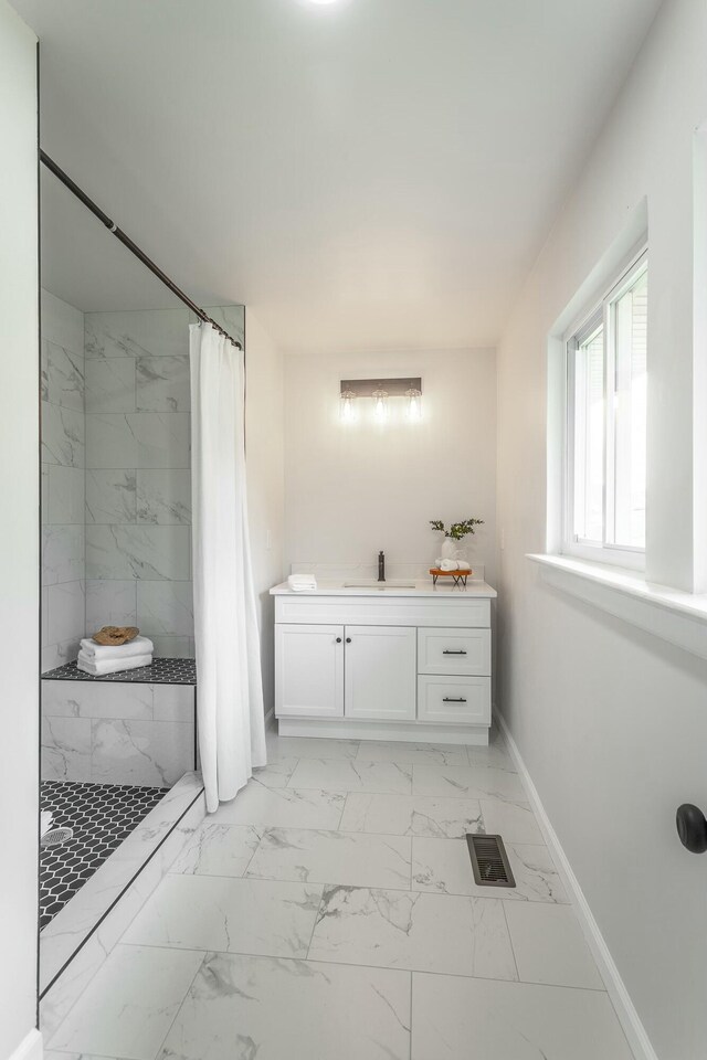 2041 Linwood Cir, Soddy Daisy, TN 37379 - full bath with visible vents, baseboards, a sink, a tile shower, and marble finish floor