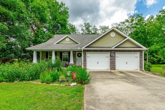901 Haggard Rd, Ringgold, GA 30736 - ranch-style home with an attached garage, driveway, a porch, and a front lawn