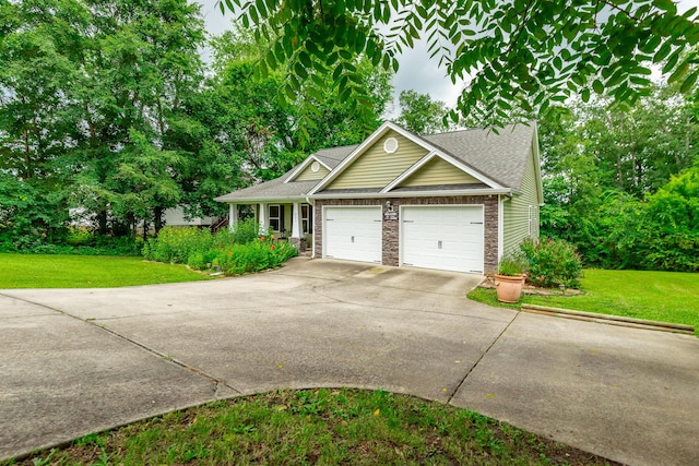 901 Haggard Rd, Ringgold, GA 30736 - view of front facade featuring driveway, a front lawn, and an attached garage