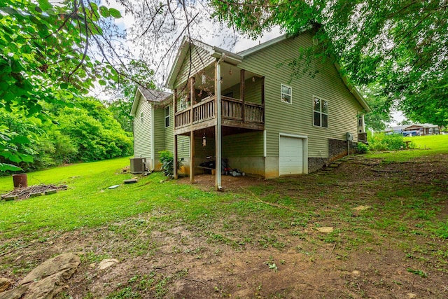 901 Haggard Rd, Ringgold, GA 30736 - back of property with an attached garage, a deck, and a lawn