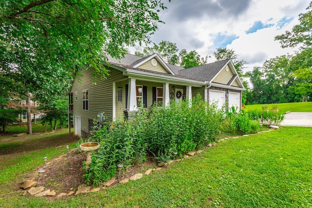 901 Haggard Rd, Ringgold, GA 30736 - view of property exterior featuring a lawn, a porch, an attached garage, driveway, and a shingled roof
