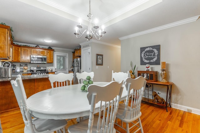901 Haggard Rd, Ringgold, GA 30736 - dining area with ornamental molding, a chandelier, and light wood finished floors