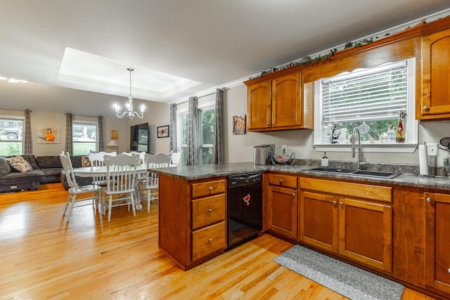 901 Haggard Rd, Ringgold, GA 30736 - kitchen with dishwasher, light wood-style floors, dark countertops, and a peninsula