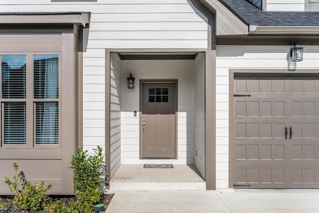 property entrance with roof with shingles