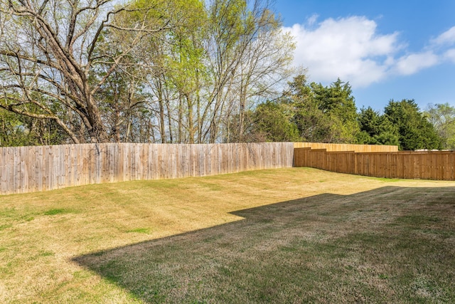 view of yard featuring a fenced backyard