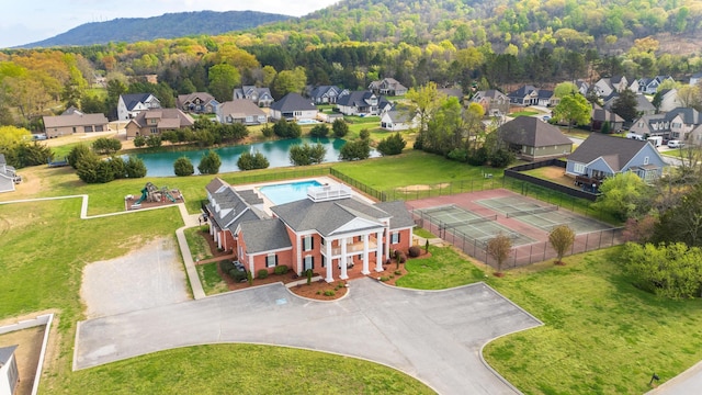 aerial view with a wooded view and a residential view
