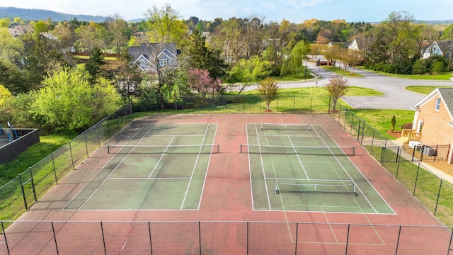 view of tennis court with fence