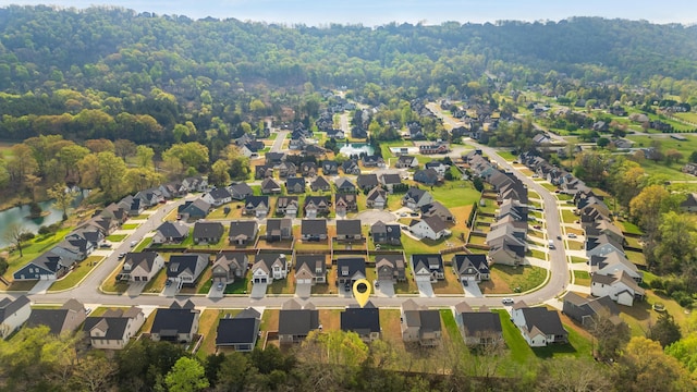 birds eye view of property featuring a residential view and a water view