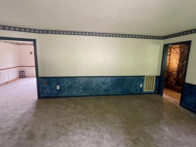 809 Chestnut Wood Ln, Chattanooga, TN 37421 - spare room with visible vents, a wainscoted wall, and carpet flooring