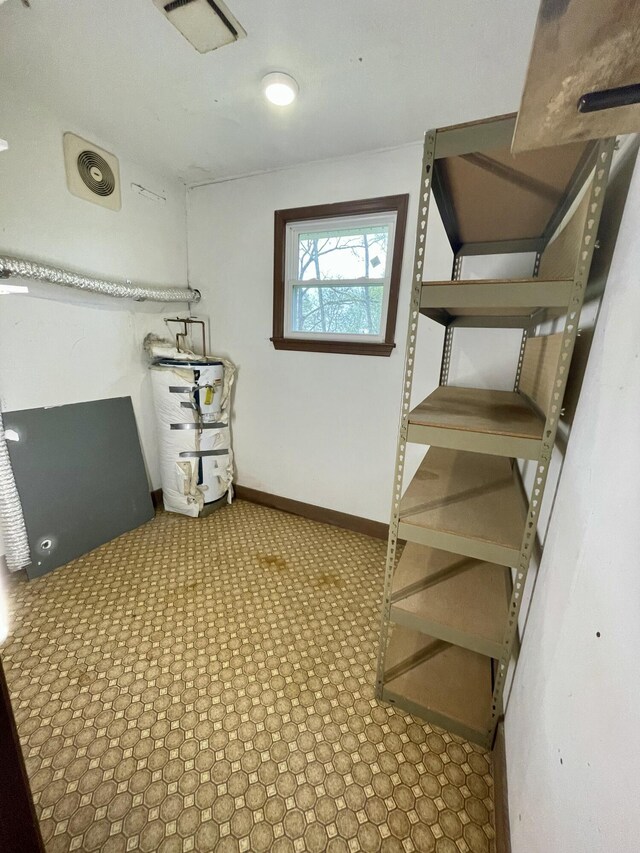 809 Chestnut Wood Ln, Chattanooga, TN 37421 - interior space with visible vents, secured water heater, and baseboards