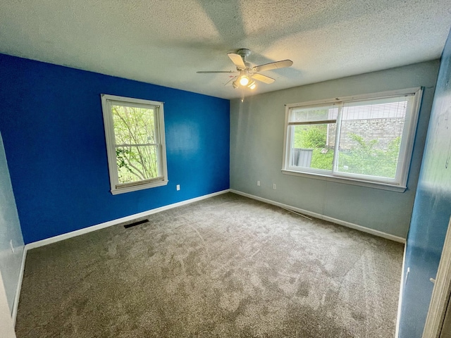 809 Chestnut Wood Ln, Chattanooga, TN 37421 - carpeted spare room featuring visible vents, baseboards, a ceiling fan, and a healthy amount of sunlight