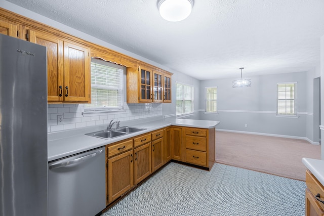 82 Andrew Rd, Ringgold, GA 30736 - kitchen featuring stainless steel appliances, a sink, a peninsula, light countertops, and a textured ceiling