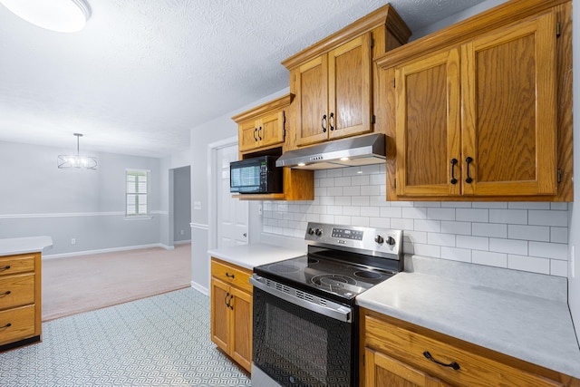 82 Andrew Rd, Ringgold, GA 30736 - kitchen with stainless steel electric stove, under cabinet range hood, light colored carpet, light countertops, and brown cabinetry