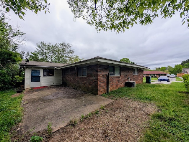 4831 Bonny Lake Ln, Chattanooga, TN 37416 - exterior space with brick siding, a front yard, and central air condition unit