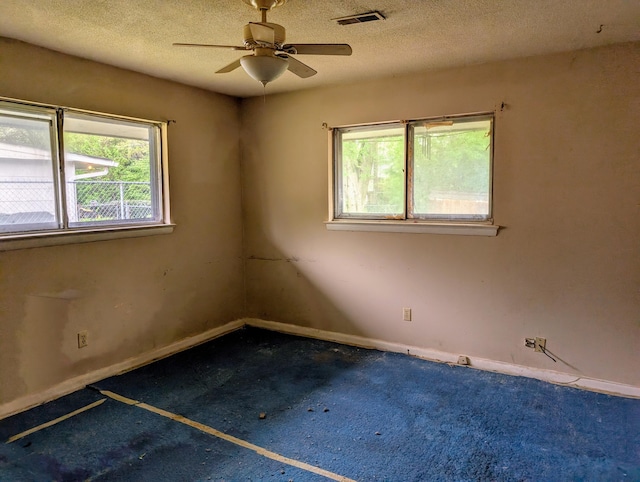 4831 Bonny Lake Ln, Chattanooga, TN 37416 - spare room with a textured ceiling, ceiling fan, baseboards, and visible vents