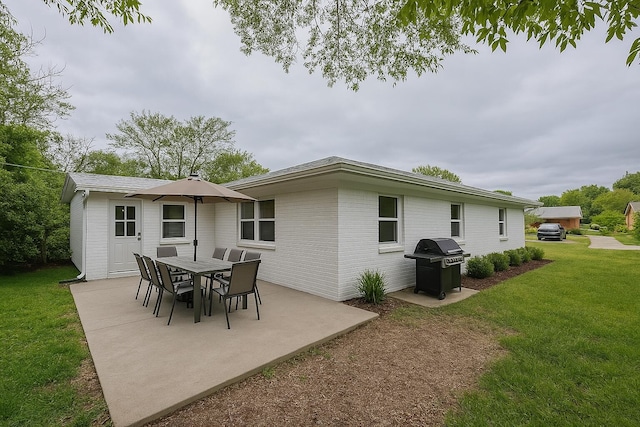4831 Bonny Lake Ln, Chattanooga, TN 37416 - rear view of property featuring a patio, a yard, and brick siding