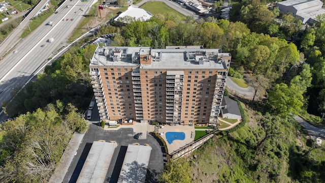 aerial view of property and surrounding area featuring a major roadway