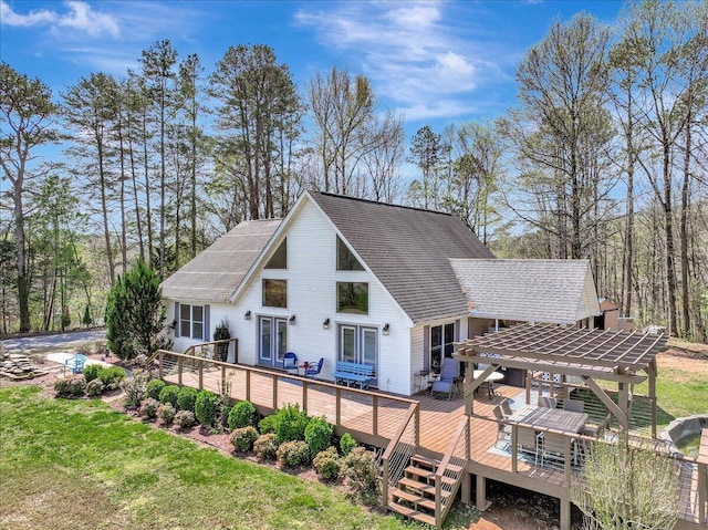 rear view of property with a pergola, a deck, french doors, and a shingled roof