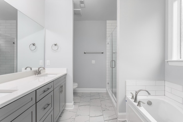 bathroom with baseboards, a bath, a sink, marble finish floor, and a stall shower