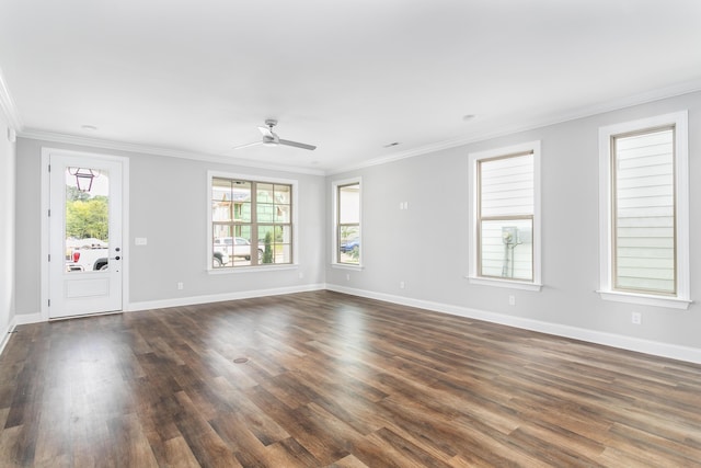 unfurnished living room with dark wood-type flooring, ornamental molding, and a ceiling fan