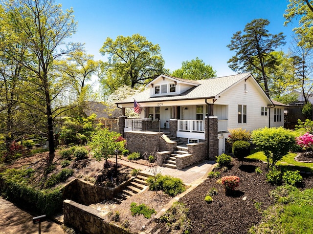 1209 Highland Dr, Chattanooga, TN 37405 - view of front facade featuring board and batten siding, stairway, covered porch, and roof with shingles