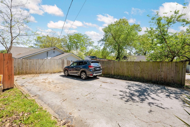 1209 Highland Dr, Chattanooga, TN 37405 - view of vehicle parking featuring fence and driveway