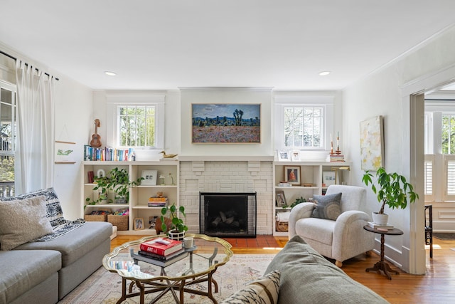 1209 Highland Dr, Chattanooga, TN 37405 - living area featuring crown molding, recessed lighting, wood finished floors, and a fireplace